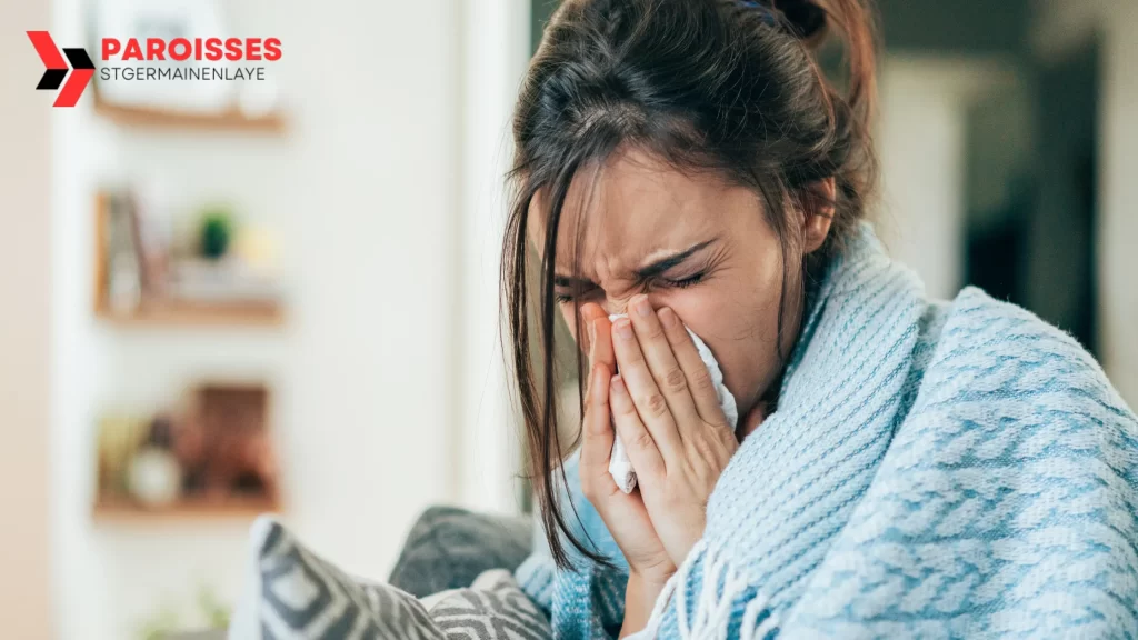 A woman wrapped in a blanket sneezes into a tissue, showing signs of illness. Focus keyword: "Can AC Cold Make You Sick?"