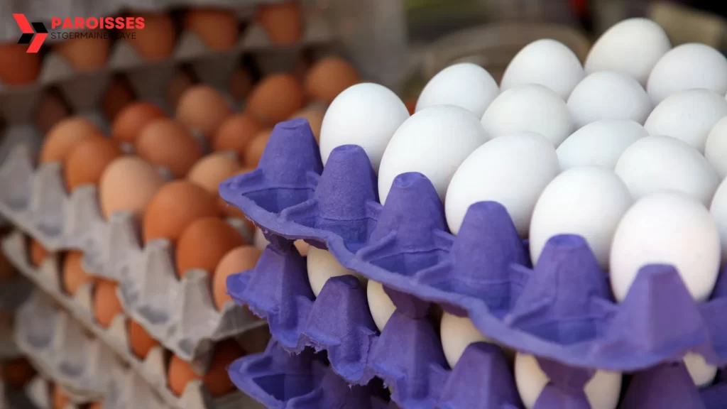 White and brown farm fresh eggs displayed in colorful cartons. How long do farm fresh eggs last without refrigeration?