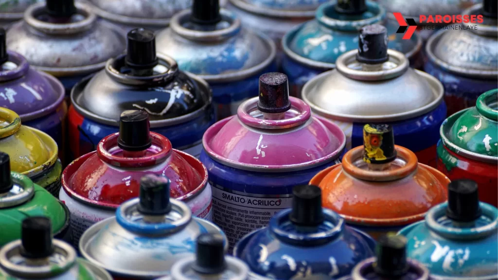 How Long Does Spray Paint Take to Dry by Surface: Close-up of colorful spray paint cans ready for use.