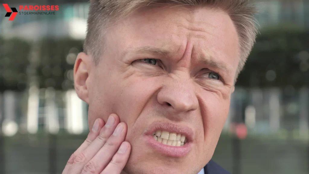 Man holding jaw in pain, highlighting the question How Long Until a Tooth Infection Kills You?